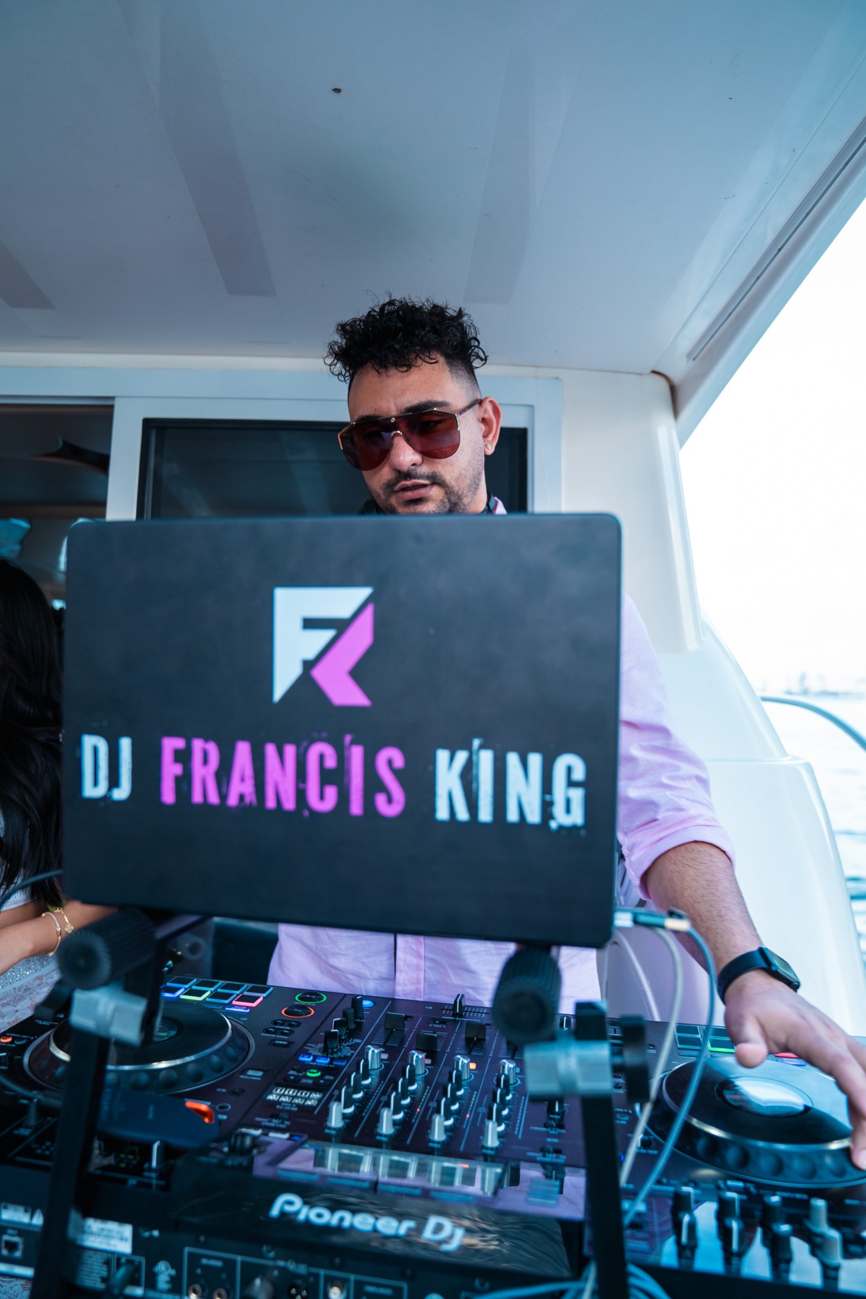 DJ Francis King performing on a yacht